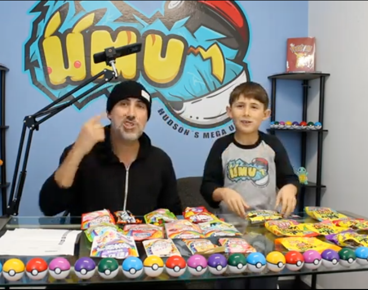 Dad and son reviewing imported snacks in a YouTube video