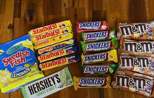 Array of international snacks laid out on a table in an Instagram post